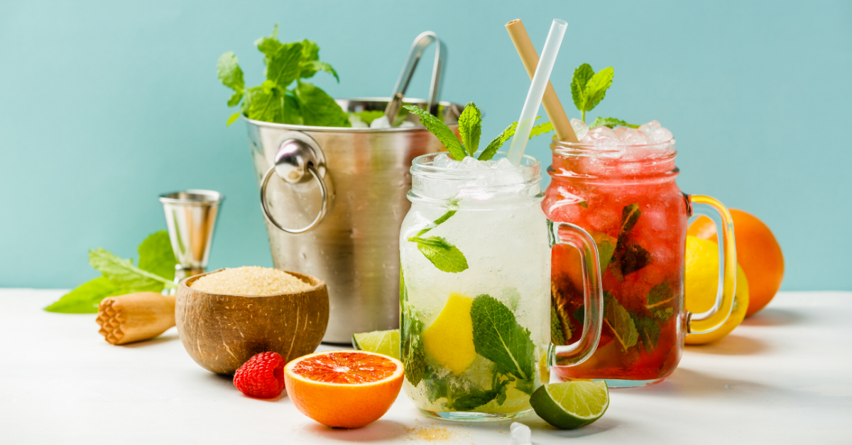 Cold and fruity drinks in mason jars.