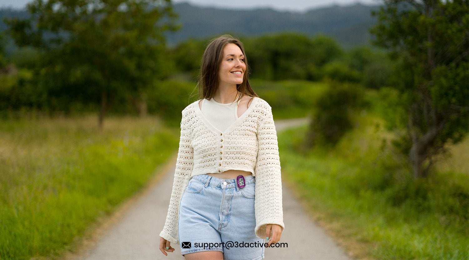  UK adult walking briskly on autumn path with 3DFitBud step counter for cholesterol management