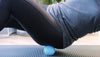 Woman using a peanut ball on her glutes
