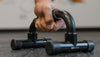 Man's hand gripping a 3DActive Push Up Bar